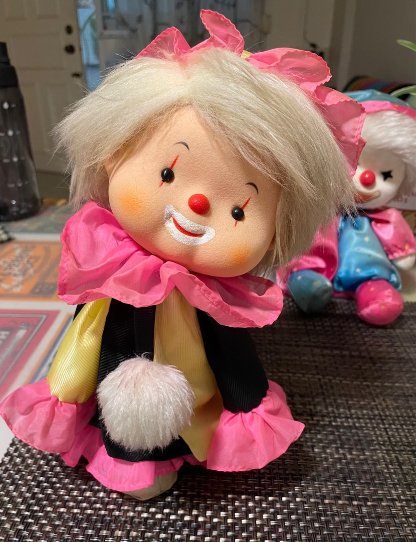 Musical clown doll top