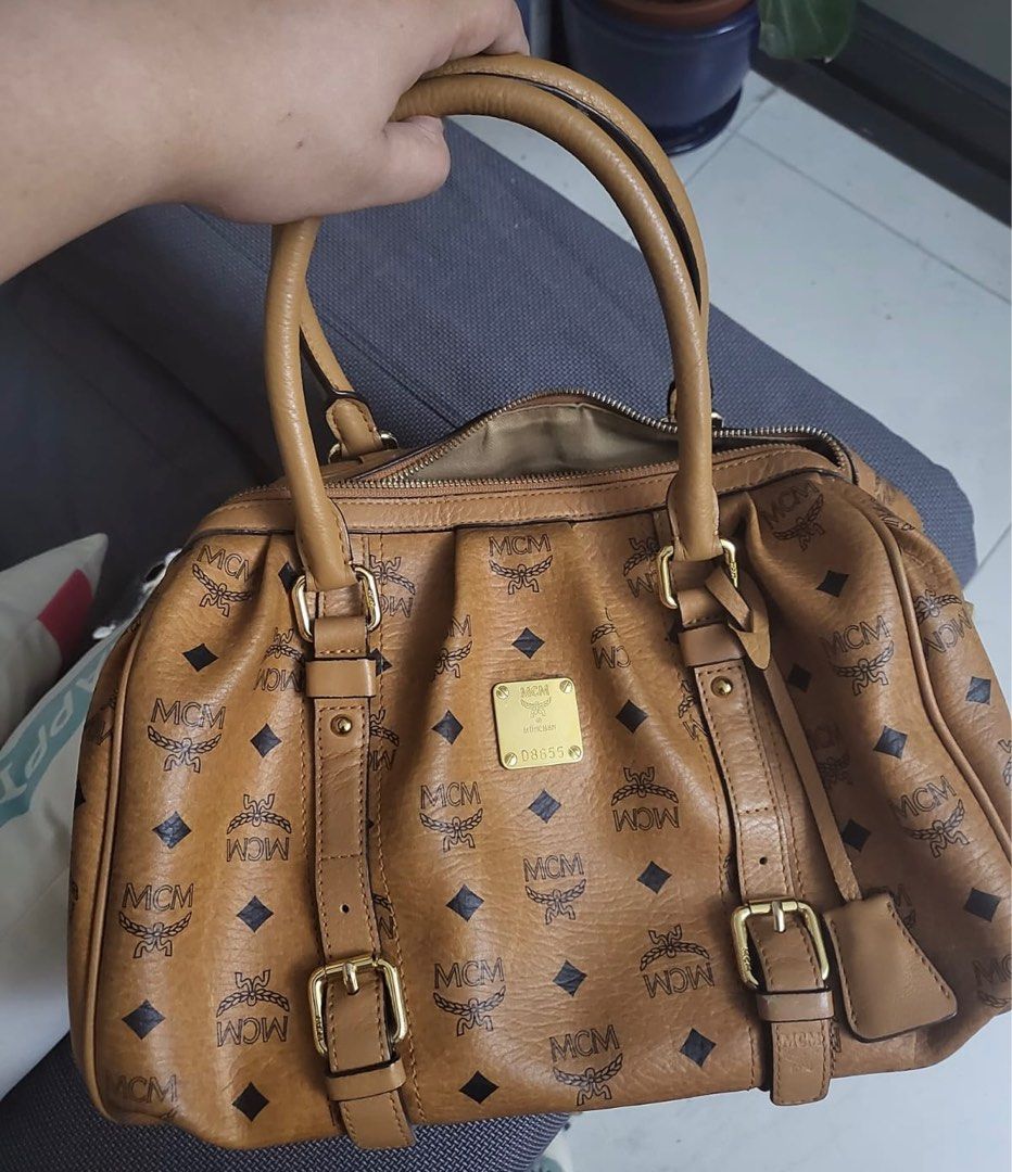 AUTHENTIC MCM VISETOS HANDBAG COGNAC LOGOPRINT MEDIUM (open for layaway) (Category: Luxury Bags & Wallets) located in Rizal. Submitted by SummerPeaCloset (Listing ID 1263838128, Image 1). Description: AUTHENTIC MCM VISETOS HANDBAG COGNAC LOGOPRINT MEDIUM (open for layaway) With lock and key .