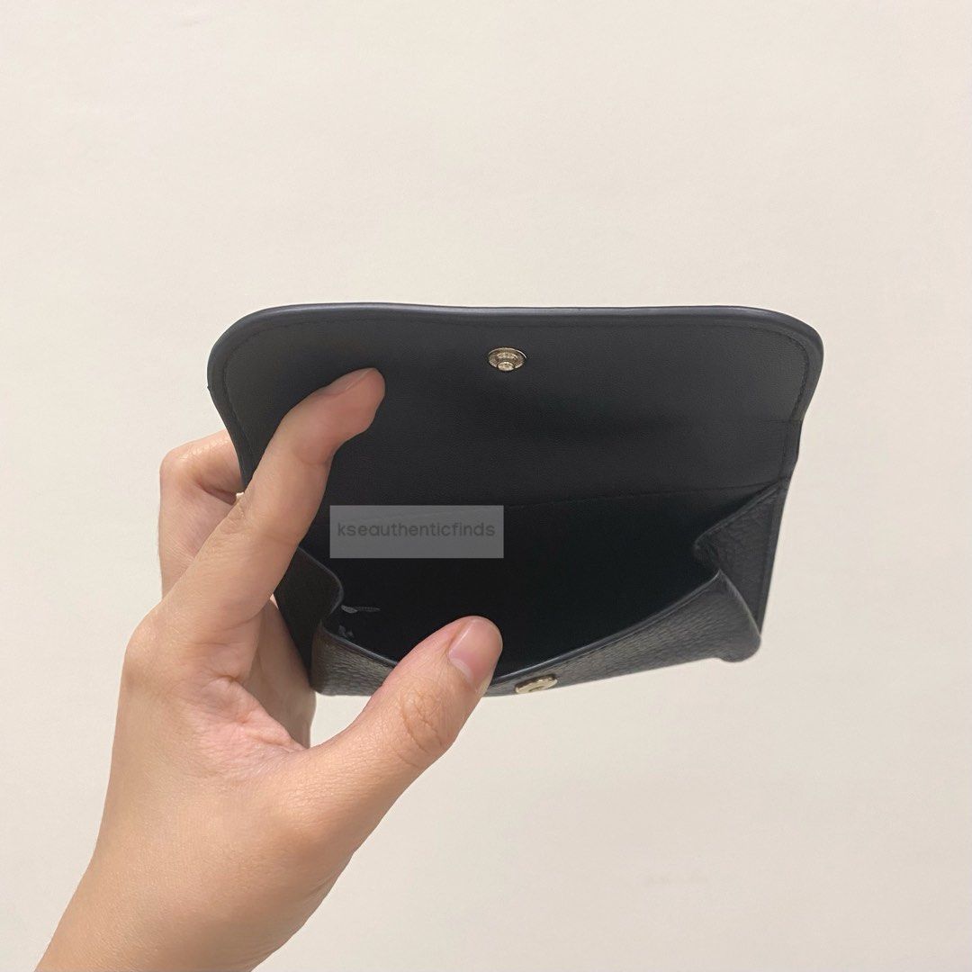 KATE SPADE Dumpling Flap Card Holder in Black (Category: Luxury Bags & Wallets) located in Pasig City. Submitted by kseauthenticfinds (Listing ID 1263751441, Image 3). Description: KATE SPADE Dumpling Small Flap Card Holder 🇺🇸🇨🇦 Inclusion: tag only Pasig on hand Product Details 3.28”h x 5”w pebbled leather 100% leather metal pinmount with spade 2 way spade jacquard lining zip pocket on back ​snap closure​.