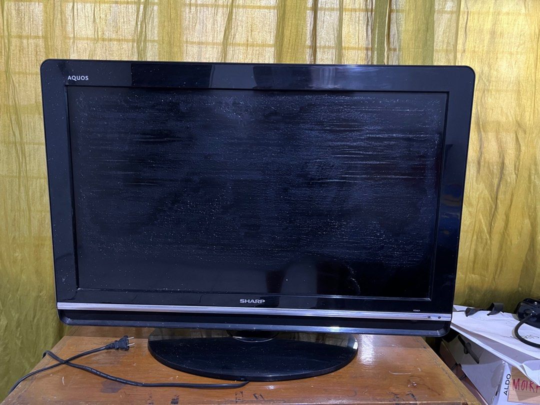 31” Sharp Aquos TV (Category: TV) located in Taguig. Submitted by r_m_g (Listing ID 1263977096, Image 1). Description: Unit is still working LED screen shows cracks from the humid weather and for not being used RFS: Decluttering .