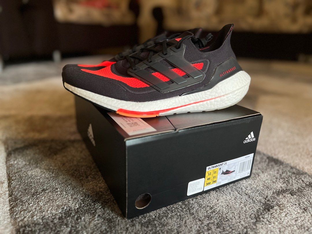 Ultra boost black and orange deals