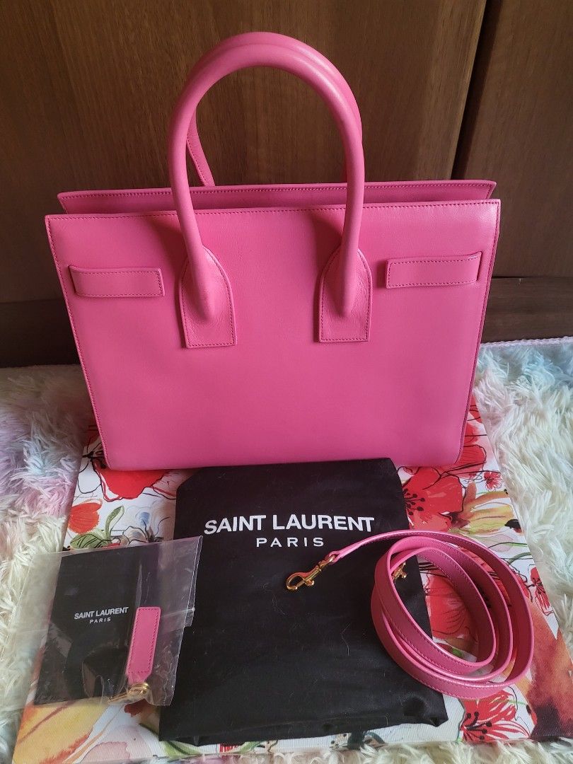 Authentic YSL Small Sac De Jour Tote (Category: Luxury Bags & Wallets) located in Rizal. Submitted by SummerPeaCloset (Listing ID 1264054669, Image 2). Description: Authentic YSL Small Sac De Jour Tote With original dustbag, long strap, papers, lock and key, clochette in good condition rank 9/10 except for a small dirt at the back - see last photo Dm only if you’re a serious buyer. No chat mates and time wasters, please. (Pass sa kwentuhan) .