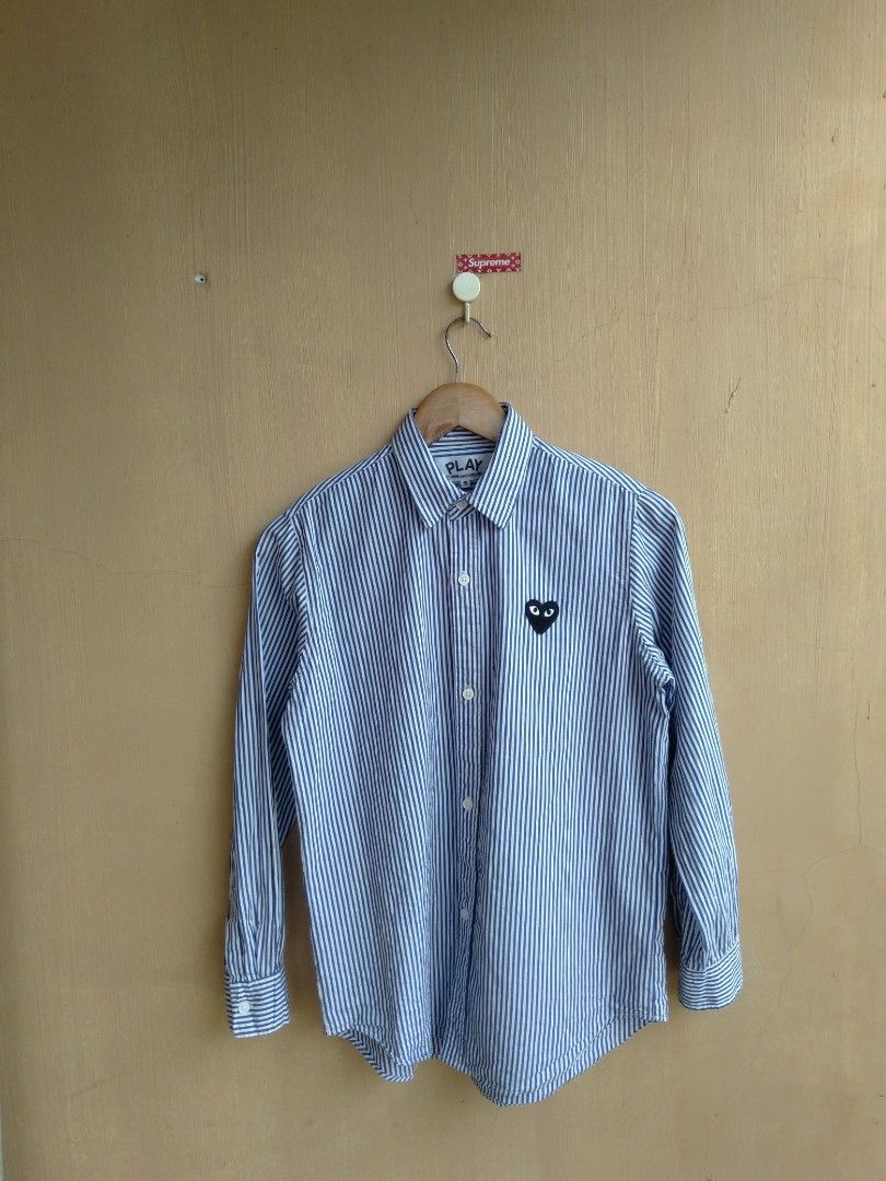 CDG play striped button down long sleeve (Category: Shirts) located in Lipa City. Submitted by MEECHYTWO2TWO (Listing ID 1263951621, Image 1). Description: CDG play striped button down long sleeve striped heart patch / small on tag dimes W20-27L Sobrang ganda pa sa personal Excellent condition color rate: 9.9/10 additional sf +75 mop: GCASH/NO COD payment first tomorrow will be shipped #09919484823.