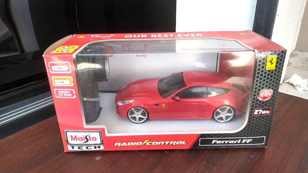Ferrari FF Radio Remote Control - Ferrari x Shell (Category: Vehicle & Diecast Models) located in Manila. Submitted by bernardo.isaac66 (Listing ID 1264240585, Image 1). Description: Ferrari FF Radio Remote Control car Ferrari x Shell Brand new In excellent condition Box sealed and never opened 1:24 model size Made by Maisto Set contains: 1 Ferrari FF model car 1 Pistol Grip Controller 1 Transmitter (Full Function - forward, reverse, left, right)