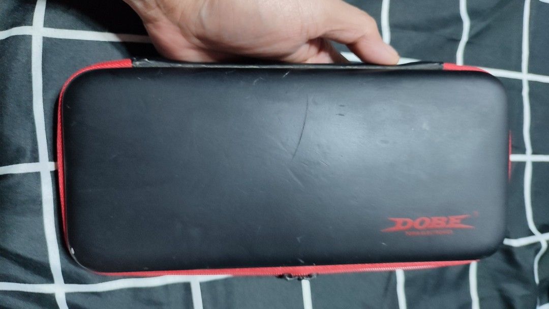 Nintendo Switch V1 Carrying Case | Dobe (Category: Cases & Covers) located in Rizal. Submitted by giorgio_tsoukalos (Listing ID 1264213957, Image 2). Description: ✅Nintendo Switch V1 Carrying Case ✅Dobe Brand ✅Inner pockets for cables ✅Small pockets for 10 game cards ✅With Signs of Usage | still in Good condition 🙏🙌🙏 ✅✅₱150 | ₱150 | ₱150✅✅ ✅Meet-Up: ✅Upper Antipolo City ✅Mode of Payment: ✅Gcash ✅RFS: Decluterring ✅Meet-Up: Upper Antipolo City 