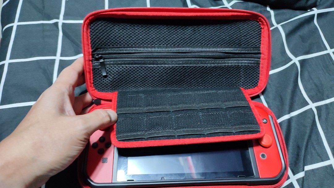 Nintendo Switch V1 Carrying Case | Dobe (Category: Cases & Covers) located in Rizal. Submitted by giorgio_tsoukalos (Listing ID 1264213957, Image 1). Description: ✅Nintendo Switch V1 Carrying Case ✅Dobe Brand ✅Inner pockets for cables ✅Small pockets for 10 game cards ✅With Signs of Usage | still in Good condition 🙏🙌🙏 ✅✅₱150 | ₱150 | ₱150✅✅ ✅Meet-Up: ✅Upper Antipolo City ✅Mode of Payment: ✅Gcash ✅RFS: Decluterring ✅Meet-Up: Upper Antipolo City 