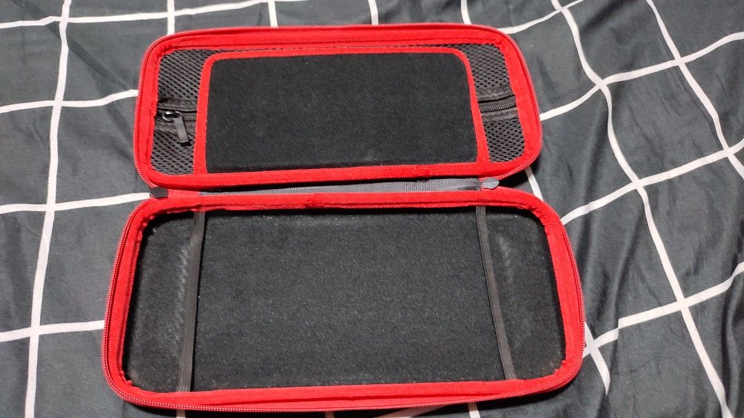 Nintendo Switch V1 Carrying Case | Dobe (Category: Cases & Covers) located in Rizal. Submitted by giorgio_tsoukalos (Listing ID 1264213957, Image 3). Description: ✅Nintendo Switch V1 Carrying Case ✅Dobe Brand ✅Inner pockets for cables ✅Small pockets for 10 game cards ✅With Signs of Usage | still in Good condition 🙏🙌🙏 ✅✅₱150 | ₱150 | ₱150✅✅ ✅Meet-Up: ✅Upper Antipolo City ✅Mode of Payment: ✅Gcash ✅RFS: Decluterring ✅Meet-Up: Upper Antipolo City 
