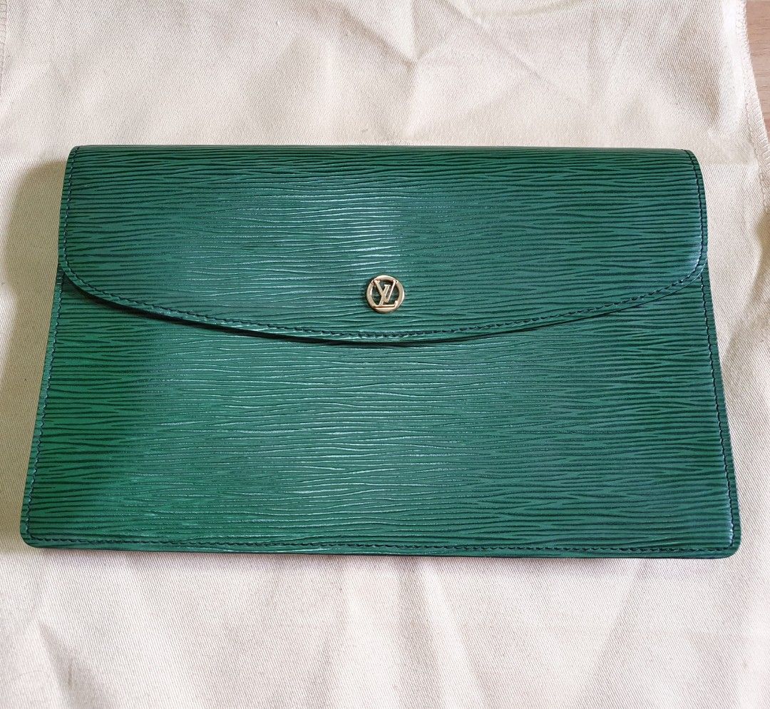 Louis Vuitton Clutch Bag (Category: Luxury Bags & Wallets) located in Manila. Submitted by mybrandshop (Listing ID 1264358632, Image 2). Description: Louis Vuitton Epi Montsigne Leather Clutch Bag Authentic with Date code color: Green with minimal flaws (di lahata pag suot, see photos) last price posted.