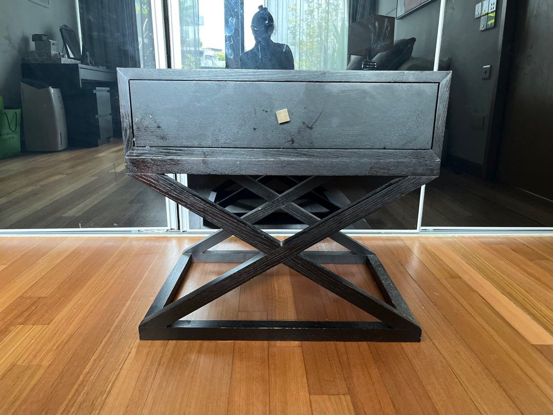 Side table (Category: Tables & Sets) located in Singapore. Submitted by themahes (Listing ID 1264289080, Image 1). Description: Well loved wooden side tables. Bought from furniture designer in Australia. Solid structure and interesting design. Large drawer space. Perfect in lounge or beside bed. .