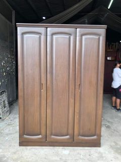 3 door wooden closet    53L x 23W x 76 1/2H inches In good condition Code akc 1120