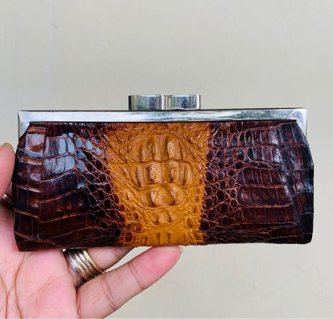CROCODILE Leather kiss lock Wallet (Category: Luxury Bags & Wallets) located in Quezon City. Submitted by WIMC2ndaccount (Listing ID 1264475687, Image 1). Description: ☑️ITEM IN JAPAN ☑️Branded ☑️100 % ORIGINAL ☑️14 X 7 CM ☑️good condition ☑️manage your EXPECTATIONS this is second hand / vintage bag HINDI po BRANDNEW Binibili mo 🔴suede inside the wallet is in good condition 🔴BAWAL NA BAWAL SA MAARTE.. 🔴NO RETURN. NO EXCHANGE 🔴Please ask all n