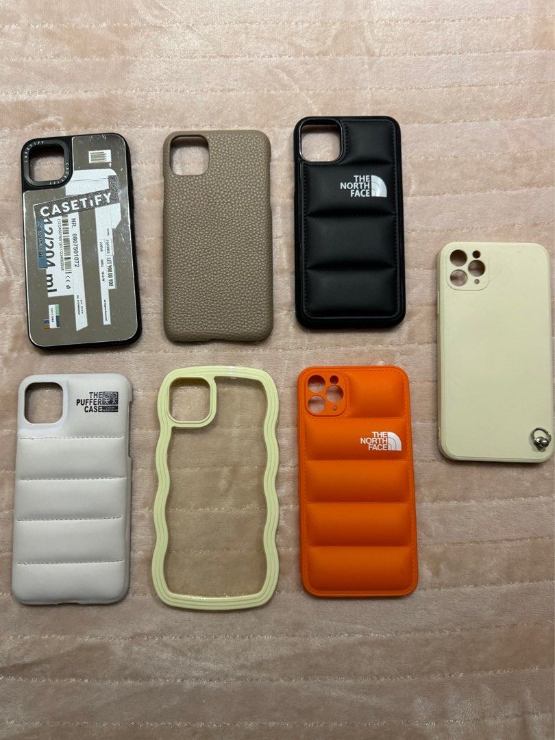 iPhone 11 Pro Max Case (Category: Cases & Sleeves) located in Manila. Submitted by declutterzoneee (Listing ID 1264562274, Image 1). Description: 50 per case 300 take all White Puffer Case - SOLD Black North Face Puffer - SOLD Leather Case - SOLD Orange North Face Puffer - SOLD Cream Wavy - SOLD.