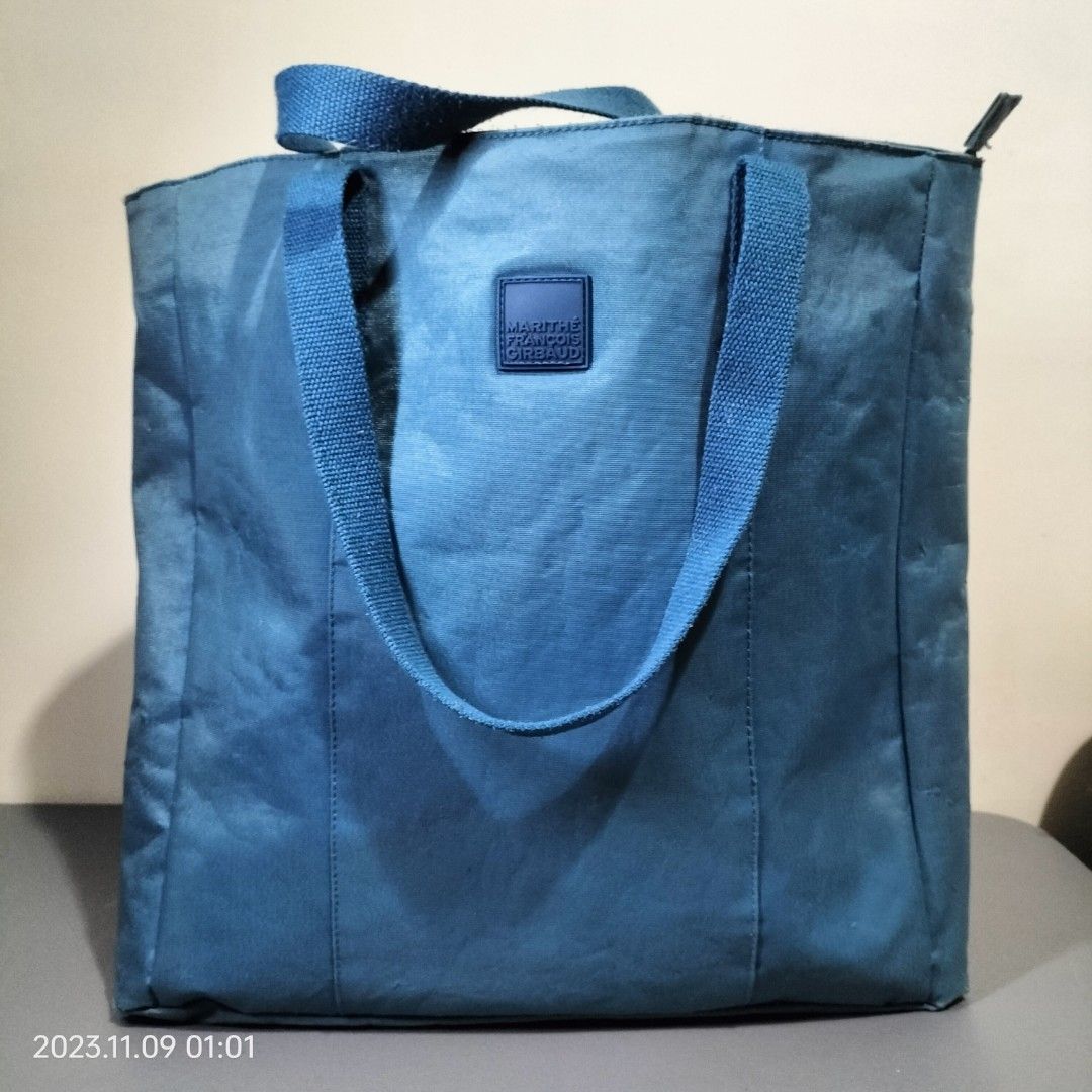 Marithe Francois Girbaud Big Blue Tote (Category: Tote Bags) located in Baguio. Submitted by livewless (Listing ID 1264605597, Image 1). Description: nice blue tote bag. 13.5" wide and 14.5" tall and 4" sides and bottom. zippered Tote. with inside and back pockets. Slight fading on sides. See exterior flaws in photos. Interior is like new. #2024declutter.