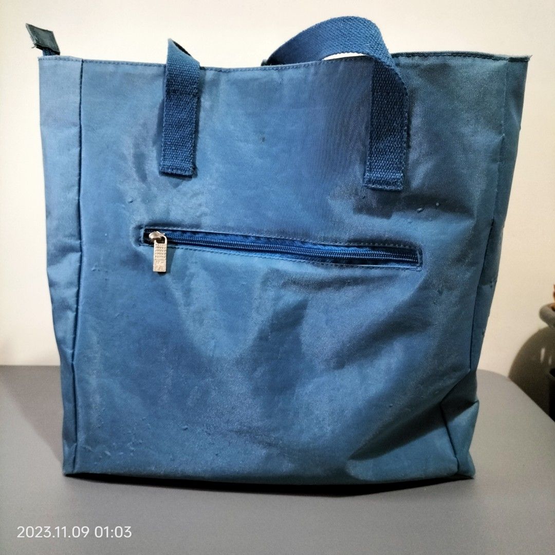 Marithe Francois Girbaud Big Blue Tote (Category: Tote Bags) located in Baguio. Submitted by livewless (Listing ID 1264605597, Image 2). Description: nice blue tote bag. 13.5" wide and 14.5" tall and 4" sides and bottom. zippered Tote. with inside and back pockets. Slight fading on sides. See exterior flaws in photos. Interior is like new. #2024declutter.