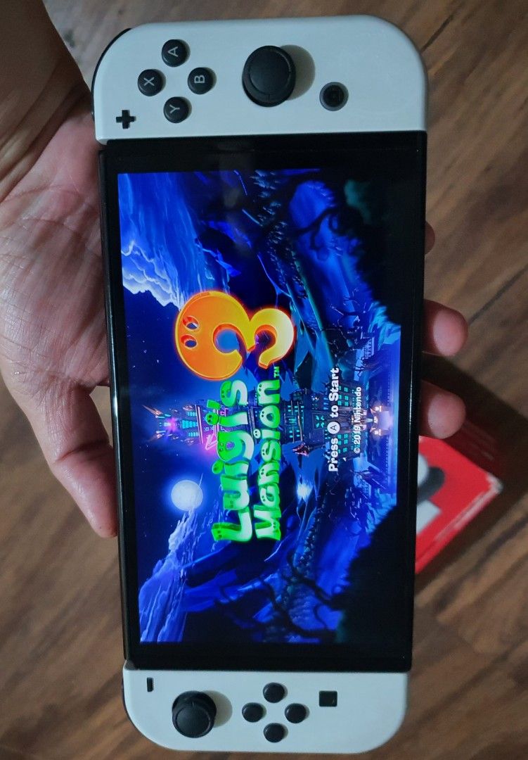 Nintendo switch OLED complete set with aaa games like luigis mansion 7