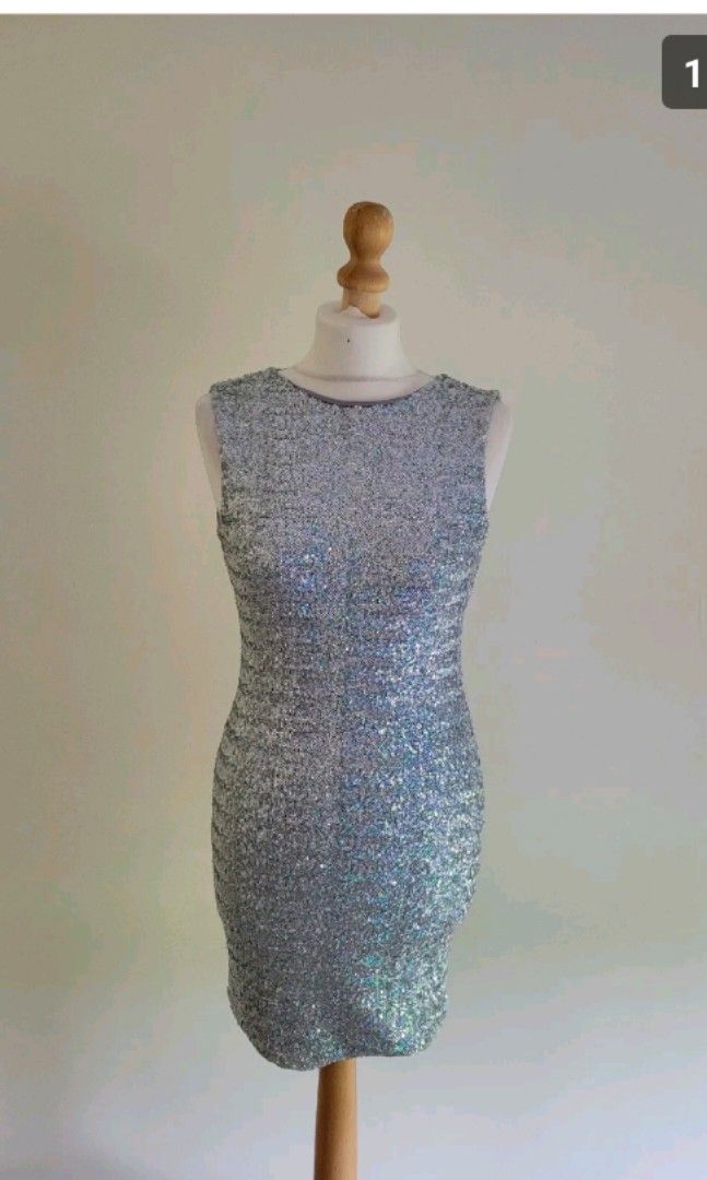 Topshop Sequins dress (Category: Dresses) located in Malabon City. Submitted by luckyfive (Listing ID 1264612760, Image 3). Description: Topshop sequins silver iridescent multi color dress, in excellent condition labelled UK 10, fits S-M more items listed everyday discount on multiple purchase follow me and get extra 5% discount, 10% to repeat customer.