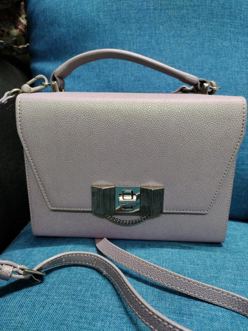 Charles and keith peacock bag online