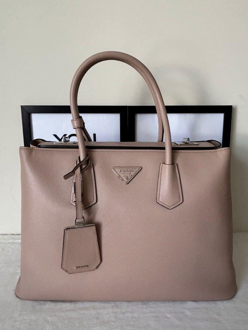 Prada Saffiano Cuir Shopping Bag (Category: Luxury Bags & Wallets) located in Manila. Submitted by bagislifeshop (Listing ID 1264775574, Image 2). Description: ☑️Available in Pampanga ✅Condition: 8.8/10 ✅Material: Saffiano cuir leather ✅Color: Cammeo in SHW ✅Size: 15” L x 7.5” W x 10” H ✅Inclusions: Authenticity card, article card and hang tag .