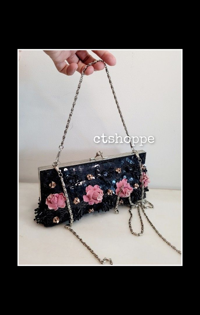 Black and pink online clutch bag