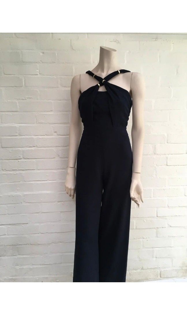 Whistles navy blue jumpsuit (Category: Jumpsuits) located in Malabon City. Submitted by luckyfive (Listing ID 1264675388, Image 2). Description: Whistles navy blue halter jumpsuit gold ring details on strap wide leg, 2 side pocket UK designer brand, high quality, structured, fake back pocket bust boning, concealed zip back pit to pit, 18 inches waist-14 lenght,side pit to hem- 51 Retails for almost 200pounds like new, fits M more items listed eve