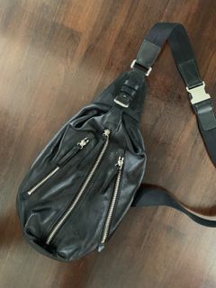 Suri small python store embossed crossbody bag