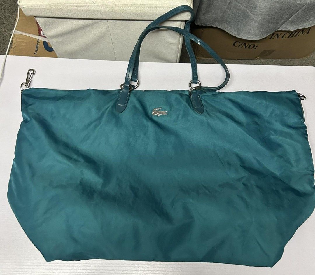 Lacoste Nylon Tote Bag (Category: Tote Bags) located in Valenzuela. Submitted by trislndgn (Listing ID 1268838149, Image 1). Description: Lacoste Nylon Tote Very Spacious All leathers and zippers are intact Slightly flaws on the body but barely noticeable See last few photos for reference of its flaws.