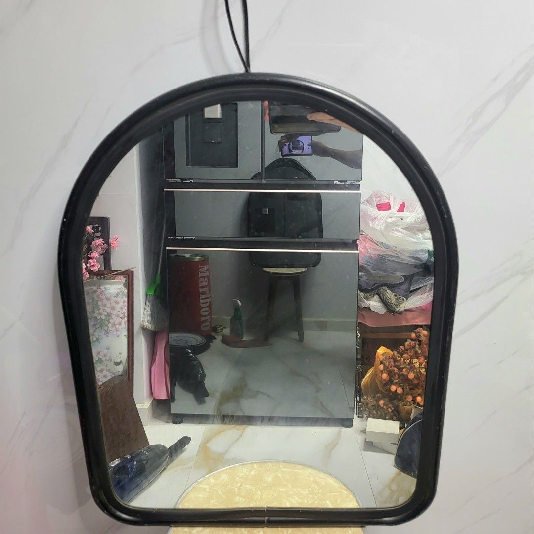 Mirror, wall hanging. Black metal frame. Size 63 x 50 x 2 cm. Weigh 2