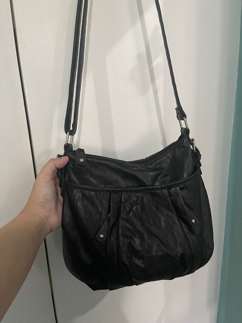 Preloved Nine&Co crossbody bag (Category: Cross-body Bags) located in Cainta. Submitted by jdcmd (Listing ID 1231002198, Image 2). Description: PRELOVED only, personal use Authentic, bought from US With signs of usage and storage RFS: decluttering Pls manage your expectations :) SF c/o buyer via lalamove, grab or lbc only No COD or COP Payment first basis Gcash or bdo bank transfer only .