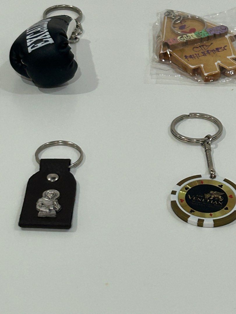 14 Key Chains Collection (Category: Character Goods) located in Paranaque City. Submitted by cfcisco (Listing ID 1270465266, Image 3). Description: Set of 14 Key Chains Key Chain from Venezia Italy BMW Key Chain from the BMW Factory in Munich, Germany Venetian Casino Chip Key Chain from Macau Key Chain of the Colosseum of Rome, Italy Padre Pio Key Chain from France Storm Trooper Key Chain from Disneyland (used) 2 Excalibur Boxing Gloves Ultraboos