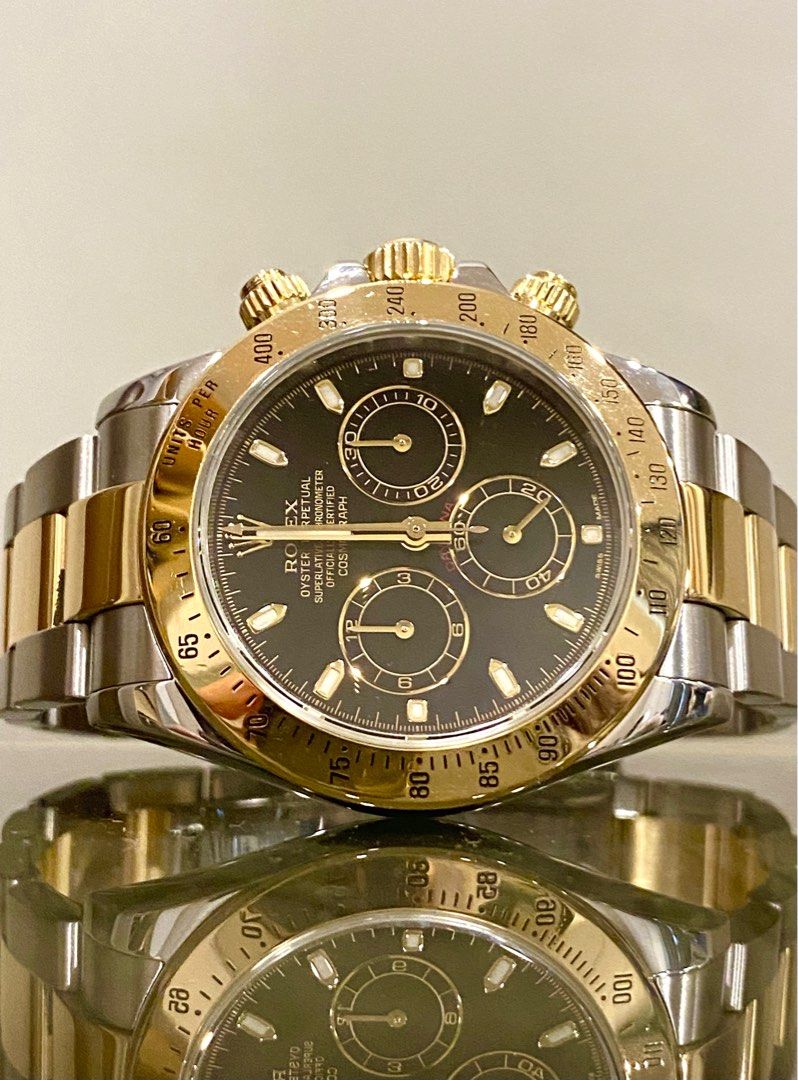 Gold rolex discount daytona black face