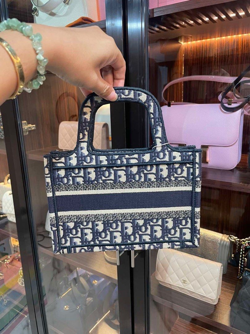 Dior Mini Book Tote (Category: Luxury Bags & Wallets) located in Makati City. Submitted by sparks.joy (Listing ID 1270503766, Image 3). Description: Guaranteed Authentic Dior Book Tote!💯 With box, dustbag, ribbon, paperbag.
