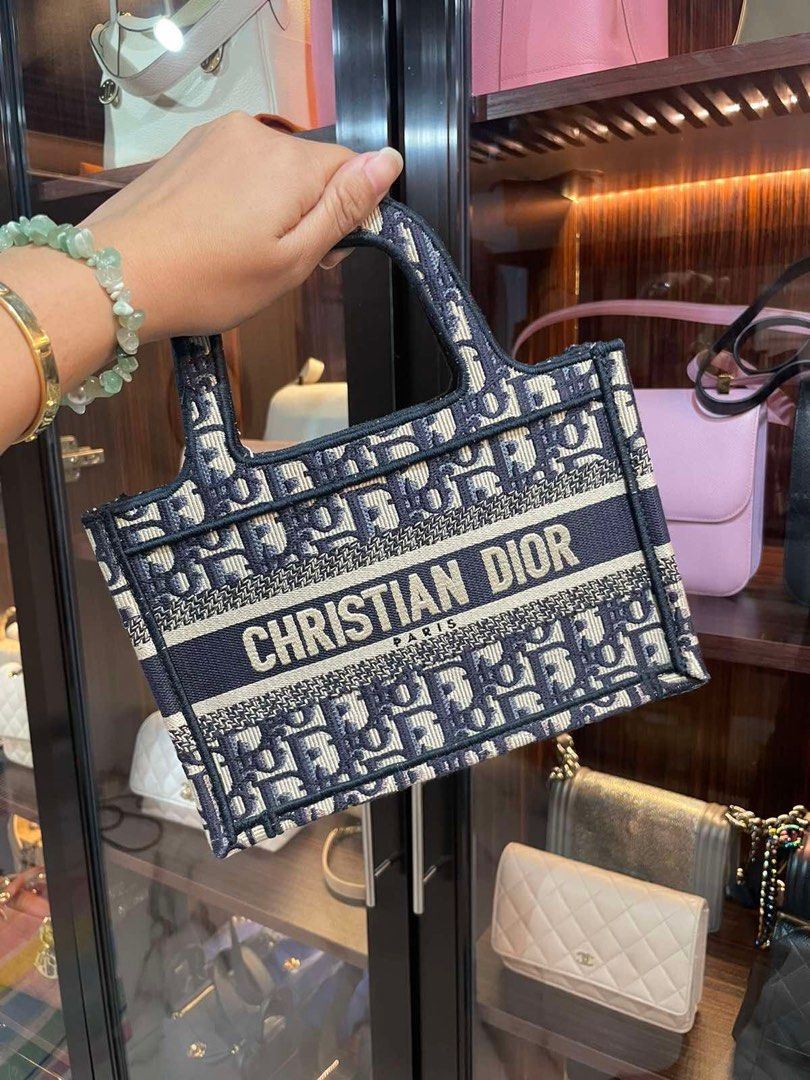 Dior Mini Book Tote (Category: Luxury Bags & Wallets) located in Makati City. Submitted by sparks.joy (Listing ID 1270503766, Image 2). Description: Guaranteed Authentic Dior Book Tote!💯 With box, dustbag, ribbon, paperbag.