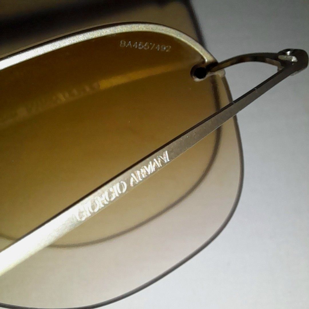 Giorgio Armani AR6004-T Sunglasses (Category: Sunglasses & Eyewear) located in Quezon City. Submitted by lovedlux (Listing ID 1270481602, Image 3). Description: No designer does Quiet Luxury better than Giorgio Armani! Unisex Retails at P14+K Serial No: 8A4557492 (3rd pic right lens) Matte pale gold titanium frame. Ultra light! Gradient brown lenses Measurements in 7th pic Bought in UAE Original case flaked due to long storage. Will replace with 