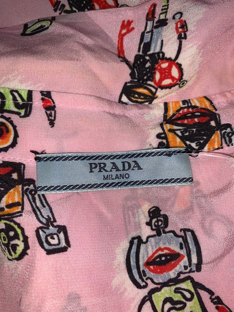 Prada longsleeves (Category: Luxury Apparel) located in Binan City. Submitted by disqualified_but_undefeated (Listing ID 1270598493, Image 2). Description: Prada Pink Robot Design Long sleeves Womens Medium Bust - 19 inches Length - 22 inches In Excellent Condition 📩📩📩📩 DM me Grab it now!!! Thanks!!!!.