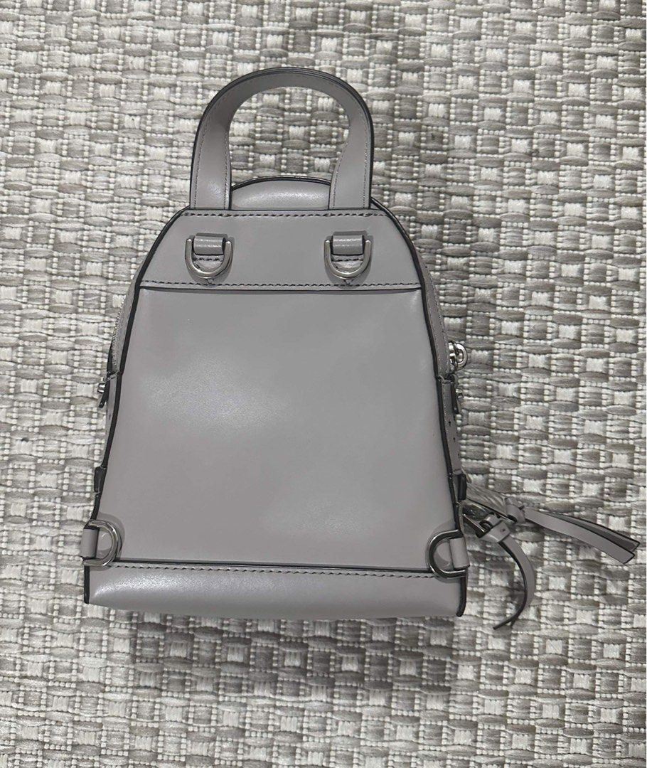 Preloved Auth MICHAEL Michael Kors Rhea Mini Perforated Leather Backpack Women s Fashion Bags Wallets Backpacks on Carousell