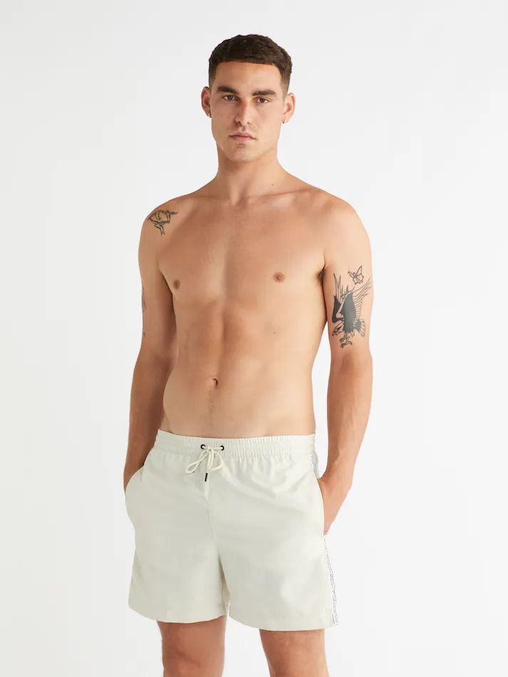 Calvin klein logo tape swim shorts 2025