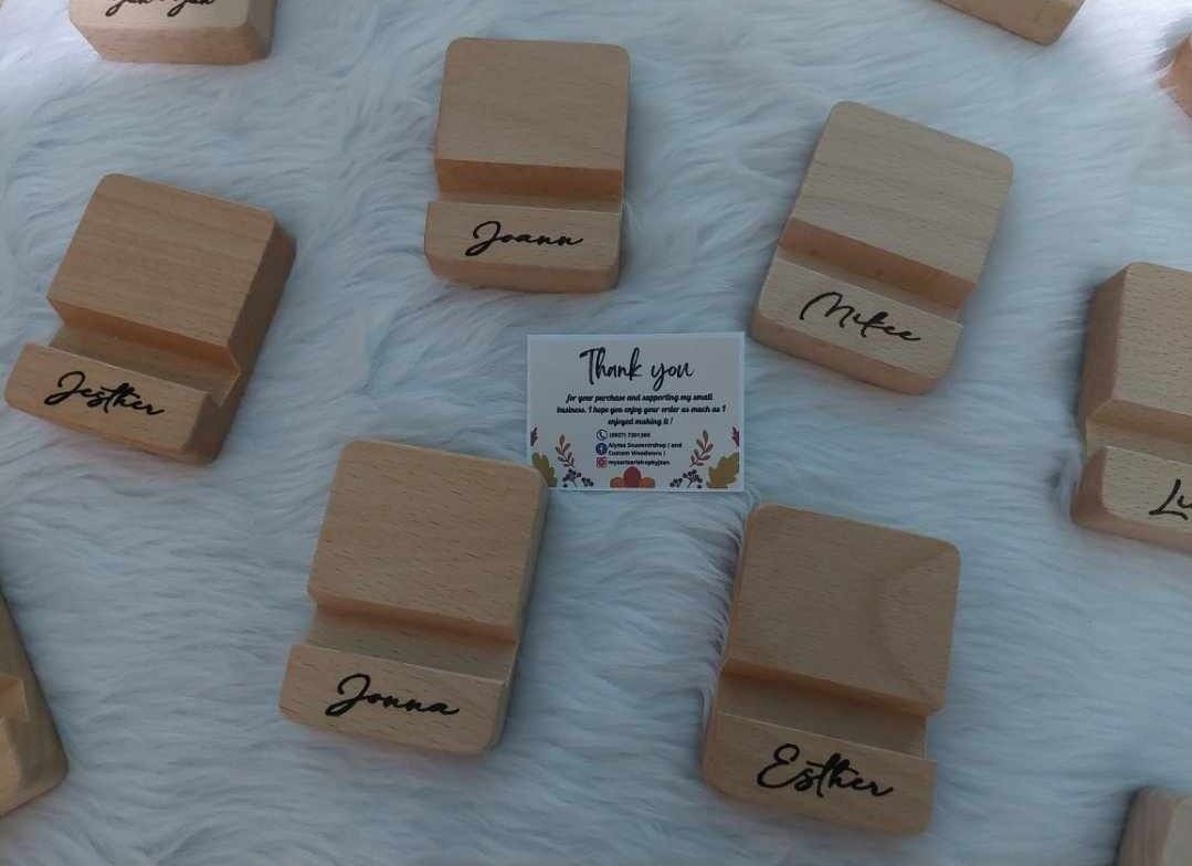 Cellphone Stand Personalized (Category: Mounts & Holders) located in Pasig City. Submitted by alyssascraftandwoodworx (Listing ID 1270649835, Image 3). Description: Personalized Best Selling Top Quality Wooden Phone Stand😊 ( Laser Engrave ) Material: Beechwood Phone Stand Size: 8 cm by 6 cm by 2 cm approx with 1.3 cm insert slot for phones For any inquiries just DM me 09277261260 ( Jill ) Thank you and God Bless ❤..