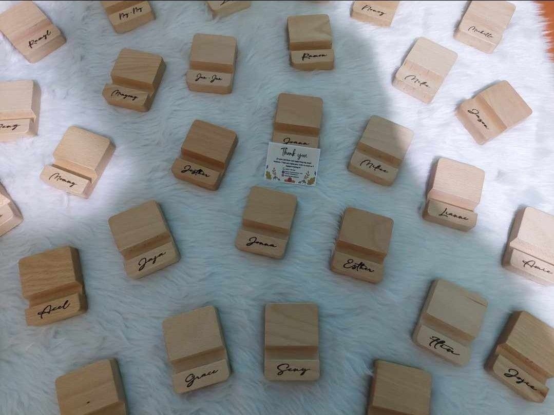 Cellphone Stand Personalized (Category: Mounts & Holders) located in Pasig City. Submitted by alyssascraftandwoodworx (Listing ID 1270649835, Image 1). Description: Personalized Best Selling Top Quality Wooden Phone Stand😊 ( Laser Engrave ) Material: Beechwood Phone Stand Size: 8 cm by 6 cm by 2 cm approx with 1.3 cm insert slot for phones For any inquiries just DM me 09277261260 ( Jill ) Thank you and God Bless ❤..