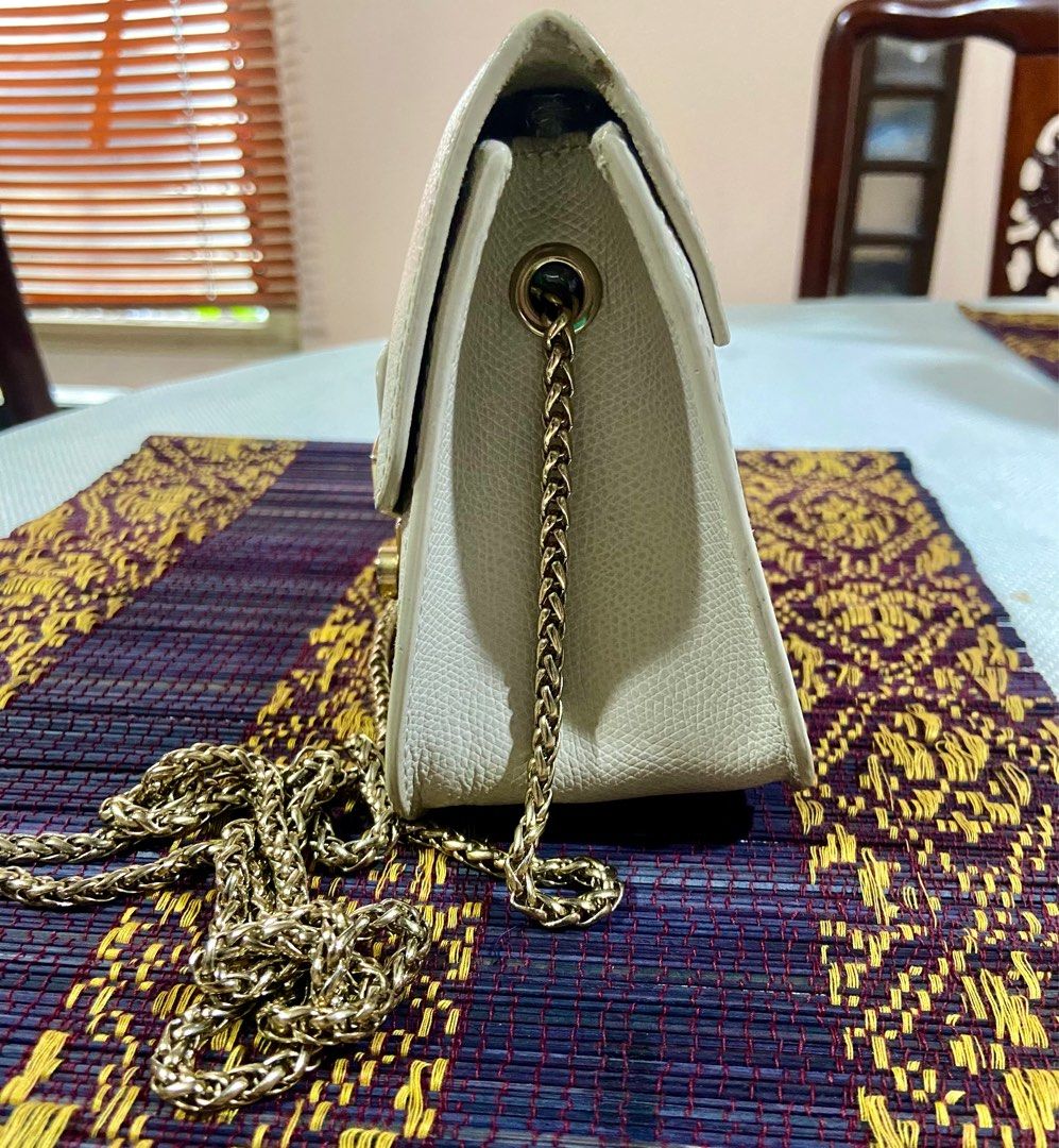 Furla Metropolis Mini Sling Bag (Category: Luxury Bags & Wallets) located in Manila. Submitted by rosamanerds (Listing ID 1270678391, Image 2). Description: Authentic preloved Furla Mini sling bag made in Italy. Off white color. In very good condition. Normal signs of use. Gamuza material on the inside of flap showing signs of use. Pls see pics.