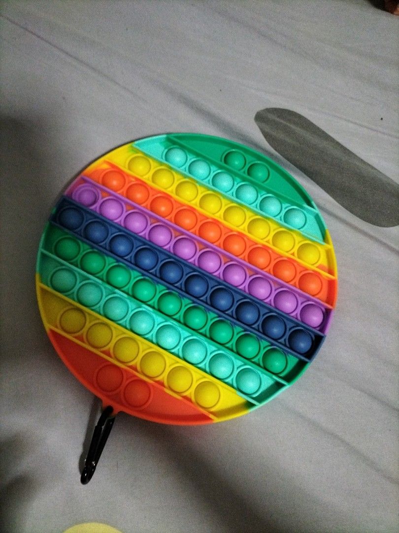 Pop it fidget toy (Category: Kids Toys) located in Singapore. Submitted by alicerandomaccount (Listing ID 1270704025, Image 1). Description: None of pop is damaged, can hook and didn use for a long time (but is clean) PM me if intrested Meet up at any mrt station of ur choice Cash at meet up.