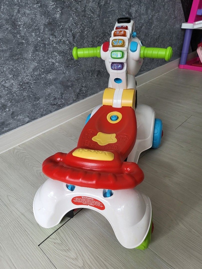 Fisher price online zebra scooter