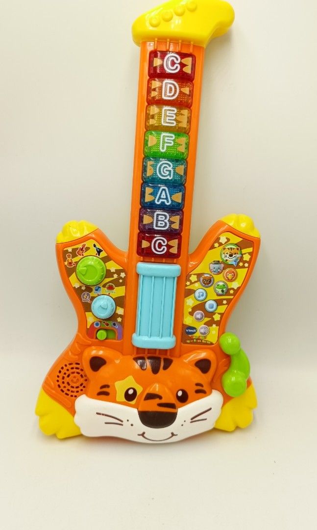 Tiger guitar toy top