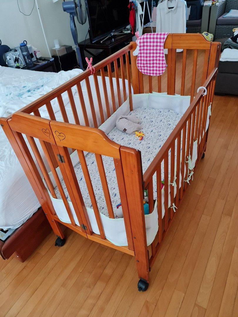 Wooden fordable baby cot on wheels Babies Kids Baby Nursery