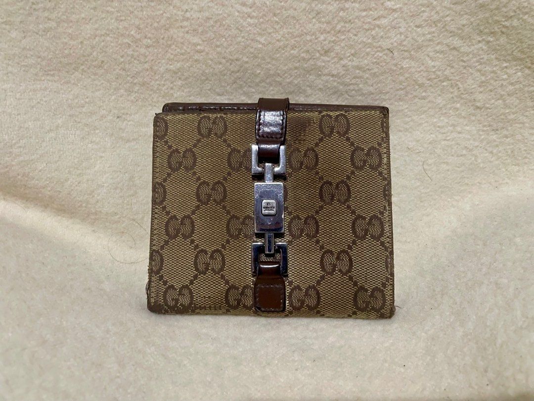 GUCCI monogram wallet (Category: Luxury Bags & Wallets) located in San Pablo. Submitted by prelovedbymistyblue (Listing ID 1271317511, Image 1). Description: Authentic GUCCI wallet. Canvass and leather combination. With signs of use and minimal rubs on the canvass. Still very functional. Has many card slots. japan preloved. Selling low for 3600. .