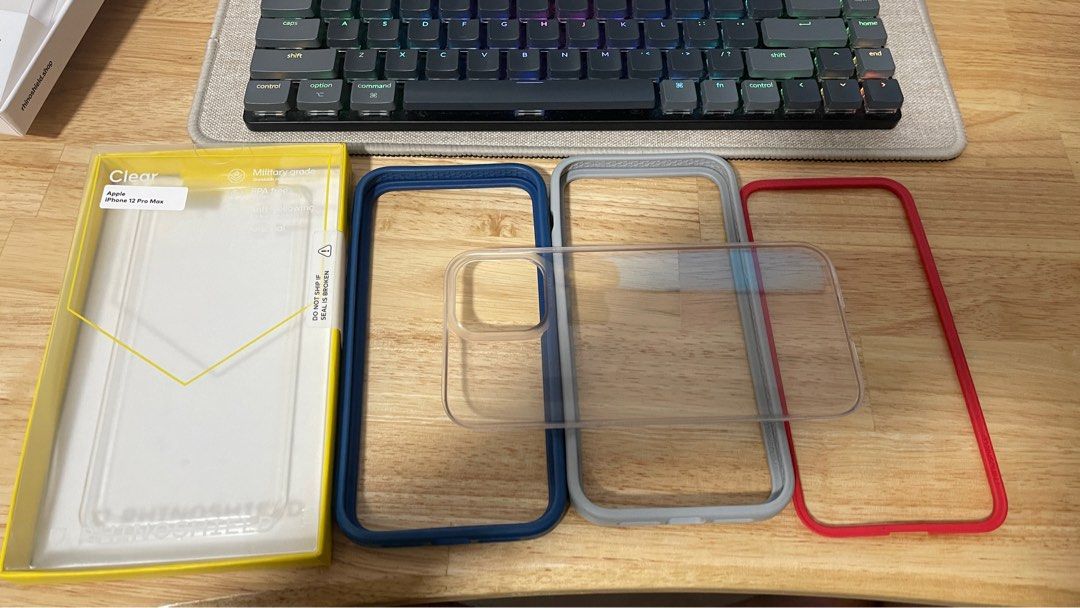 Rhinoshield Mod Case iphone 12 pro max (Category: Cases & Sleeves) located in Singapore. Submitted by guangming_ (Listing ID 1271388744, Image 1). Description: iphone 12 pro max navy and grey bumper plus 1 red rim and transparent backplate.