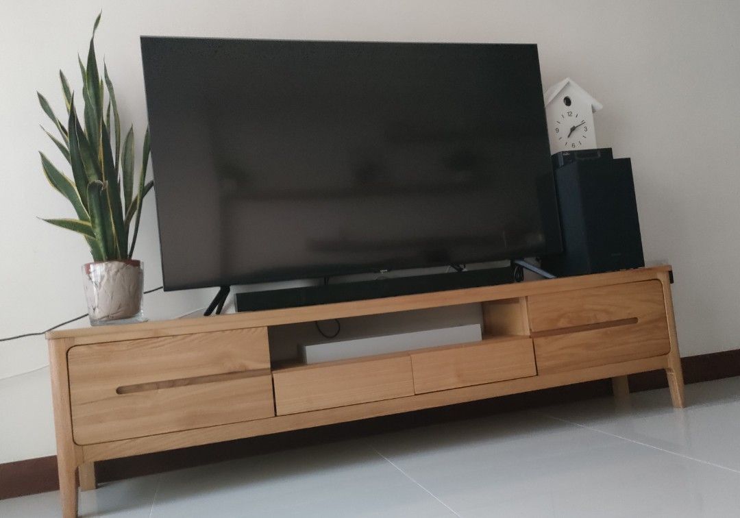 Solid Oak TV console (Category: TV Consoles) located in Singapore. Submitted by WoodNMarble (Listing ID 1271089851, Image 2). Description: No defects. 180cm x 35cm depth x 45cm high The TV on the console is 55 inches.