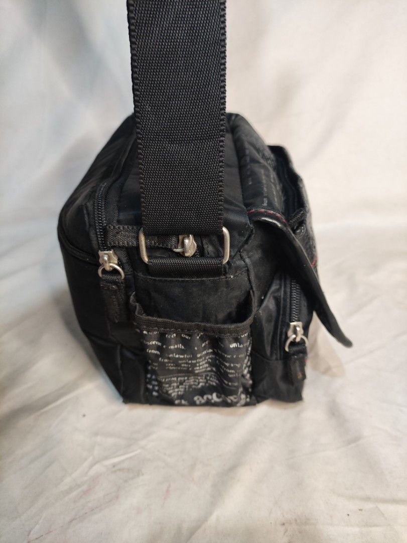 Multi compartment sling 2025 bag
