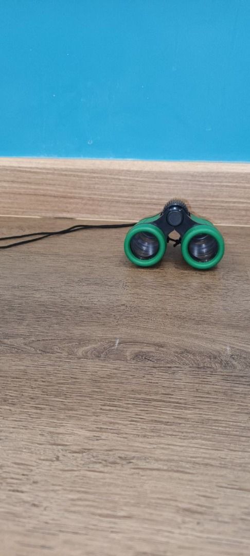 Green Binoculars with string attached (Category: Travel Essentials & Accessories) located in Singapore. Submitted by evictor (Listing ID 1271549708, Image 2). Description: height 5-5.5 cm length 8-8.5 cm.