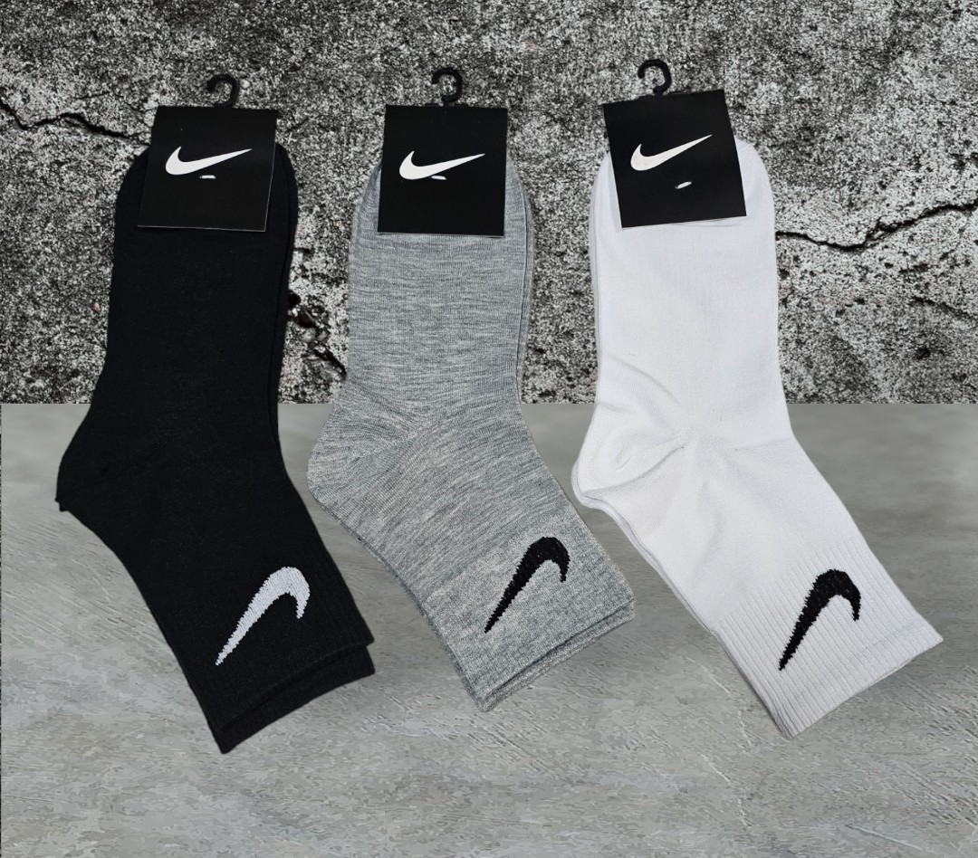 White nike socks sales with black swoosh