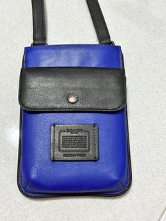 Hybrid pouch with signature canvas blocking outlet